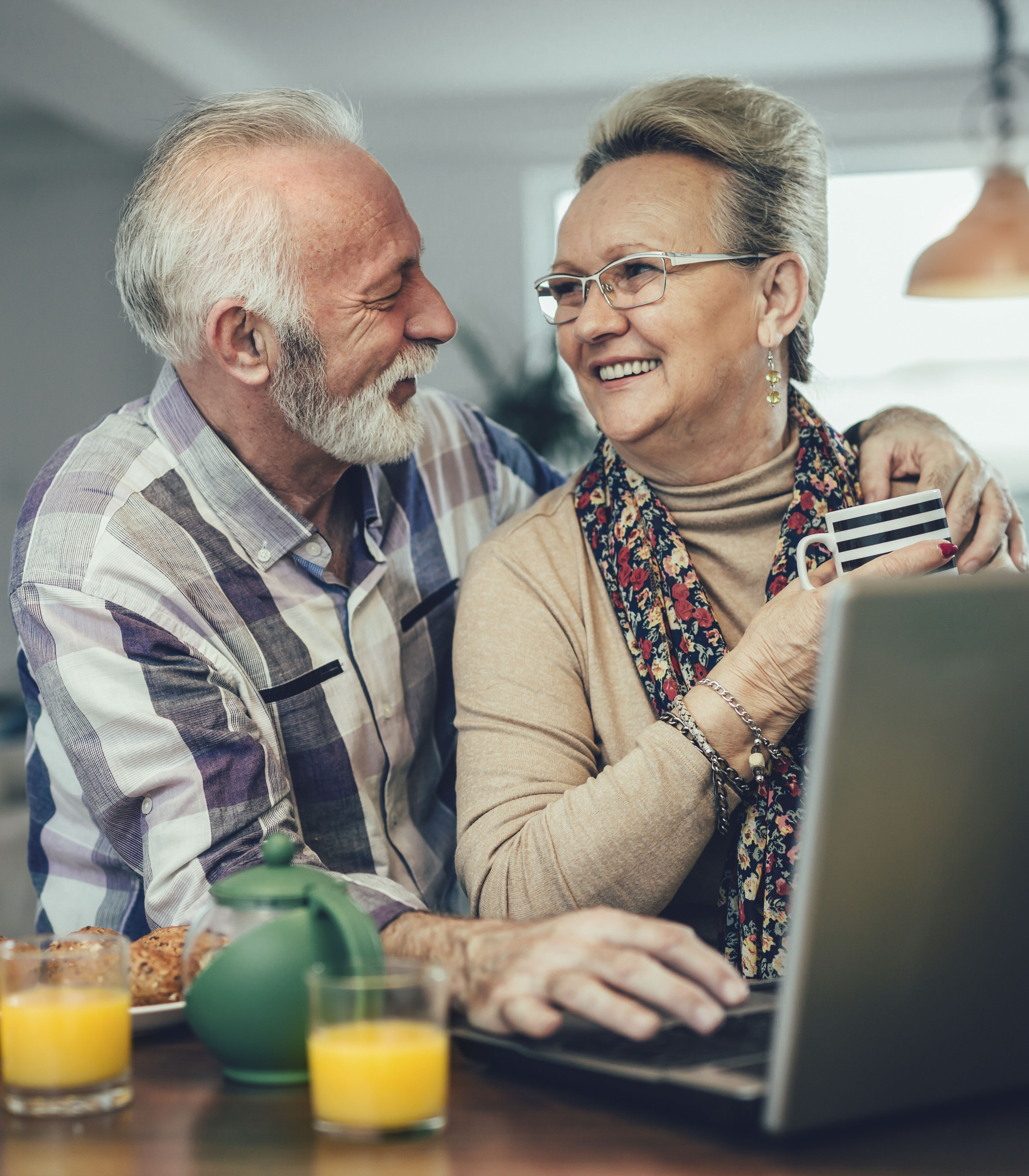 man and woman working on computer pharmacy